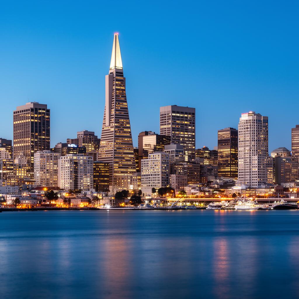 San Francisco Financial District skyline with the Transamerica Pyramid at dusk.